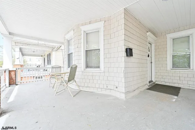 an empty room with windows and view