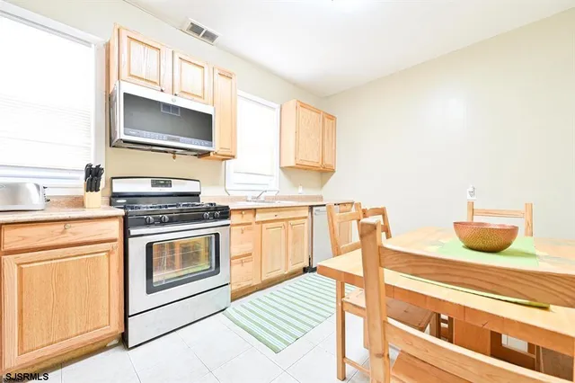 a kitchen with a stove and a microwave