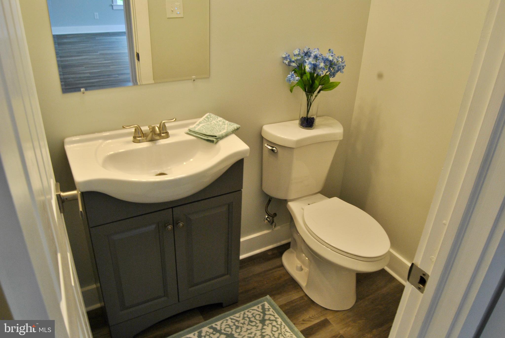 31 Ridge Road Phoenixville, PA 19460 - Photo 14 of 35 a bathroom with a sink toilet and a mirror