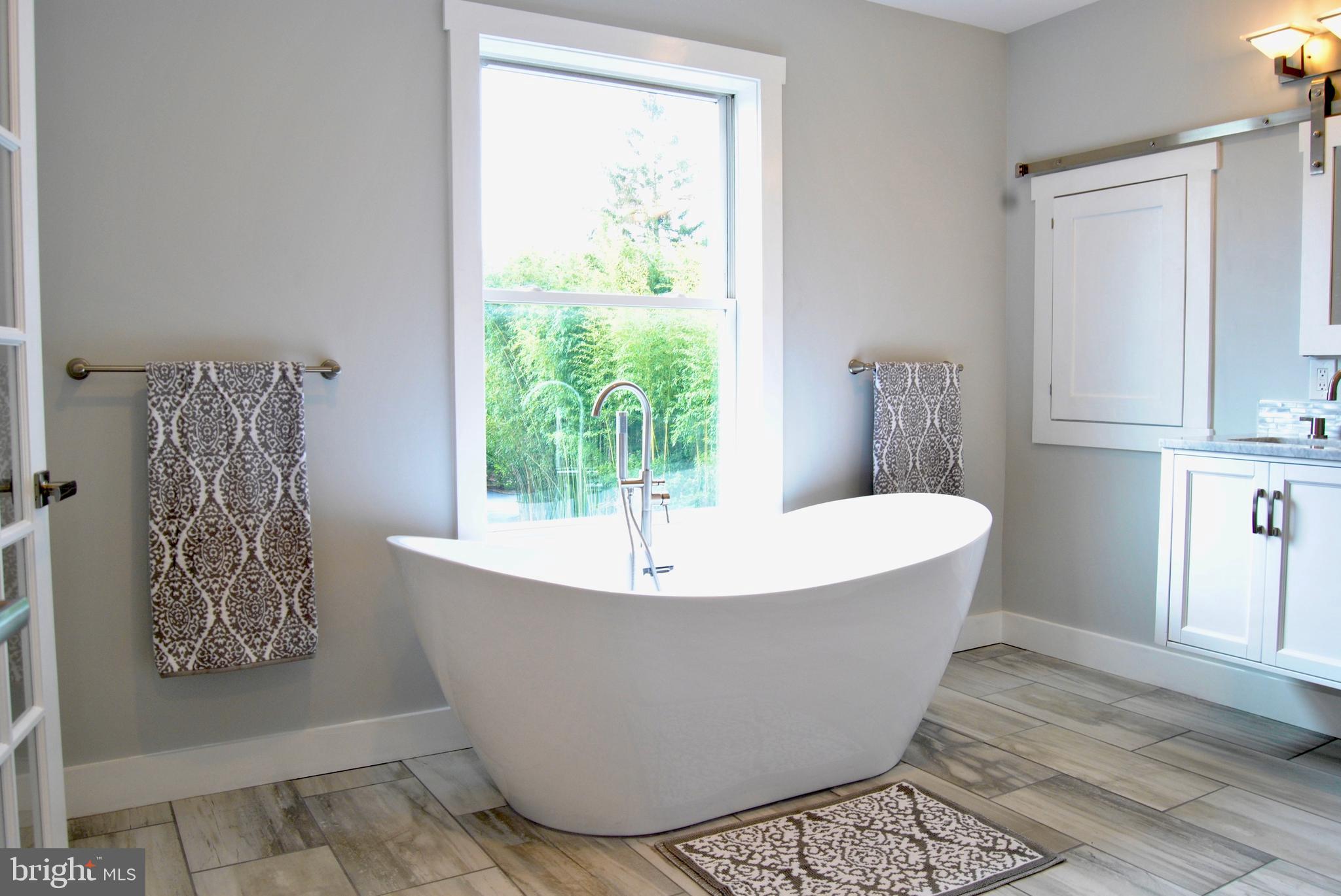 31 Ridge Road Phoenixville, PA 19460 - Photo 22 of 35 a white tub sitting next to a window