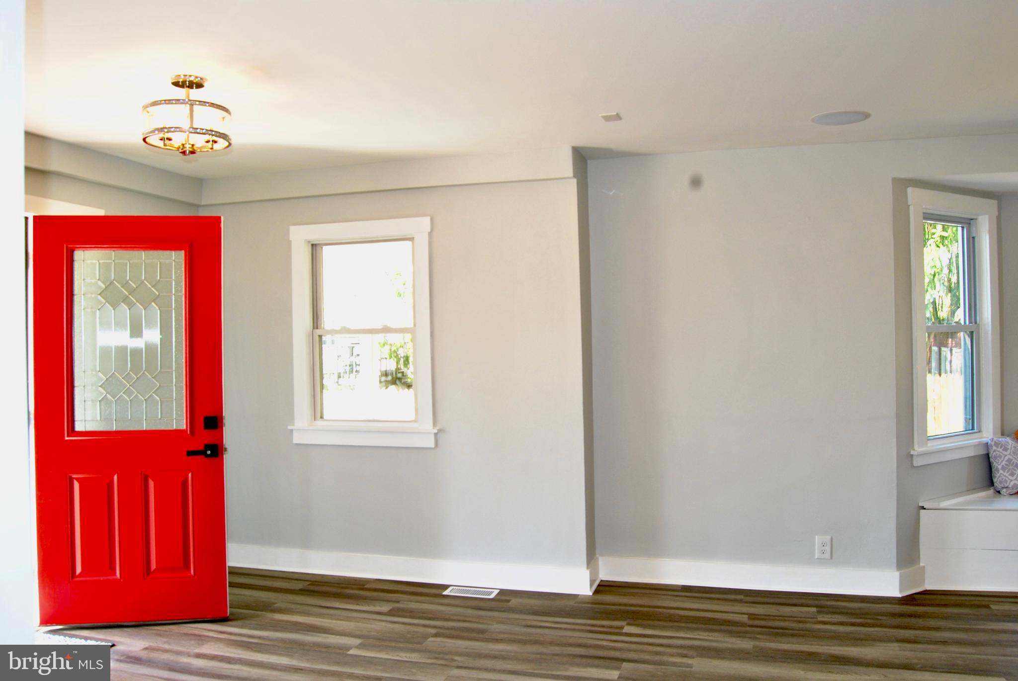 31 Ridge Road Phoenixville, PA 19460 - Photo 4 of 35 a view of hallway with window and wooden floor