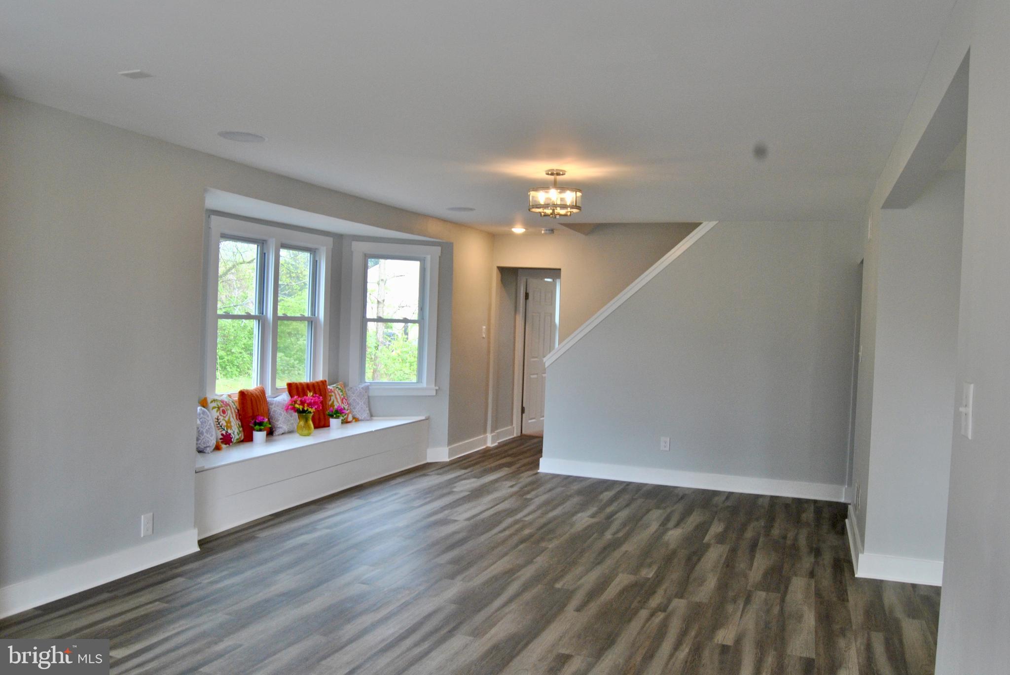 31 Ridge Road Phoenixville, PA 19460 - Photo 5 of 35 a living room with hard wood floors and a window