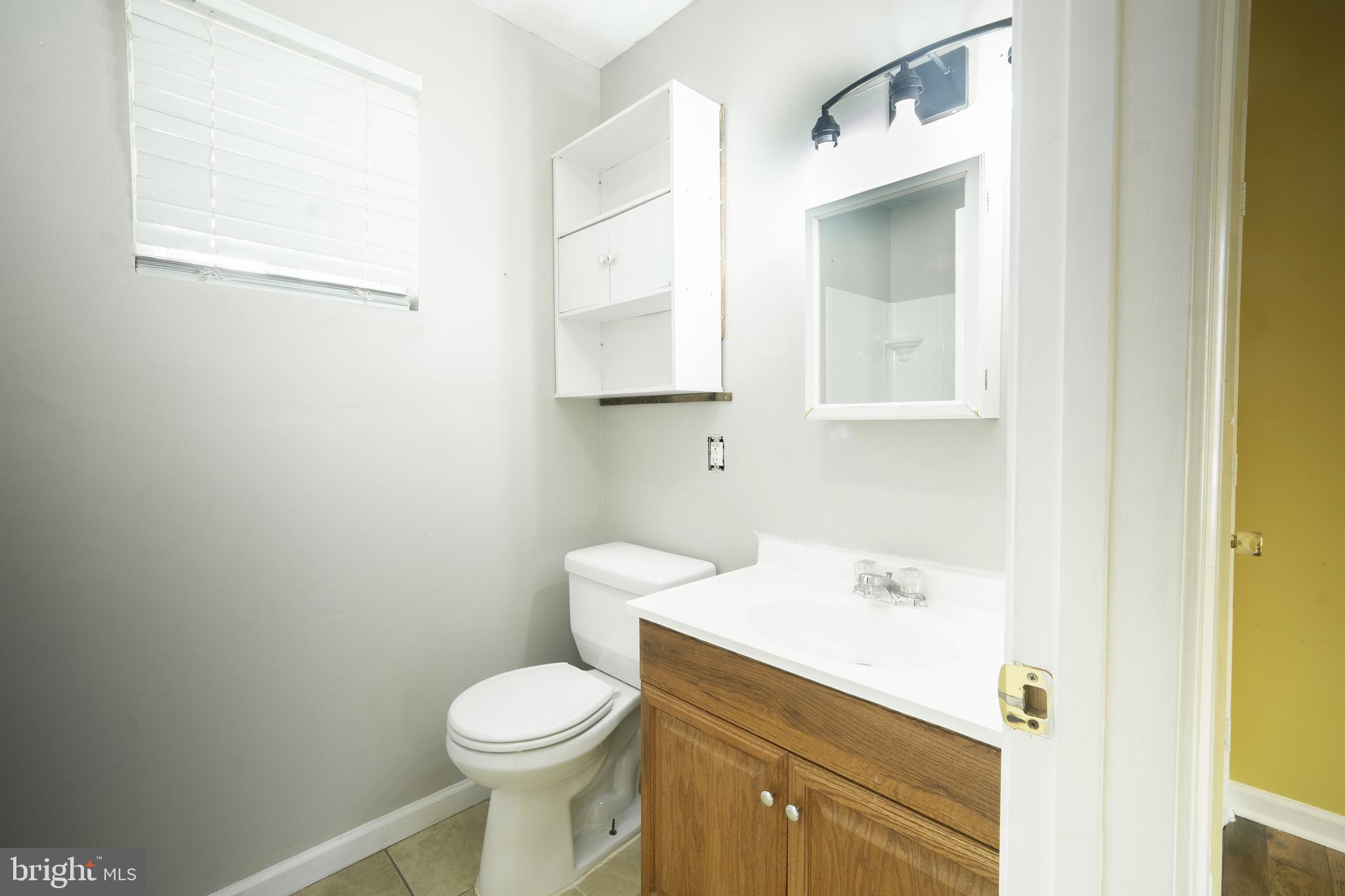452 Acton Street Front Royal, VA 22630 - Photo 15 of 44 a white toilet sitting next to a bathroom sink