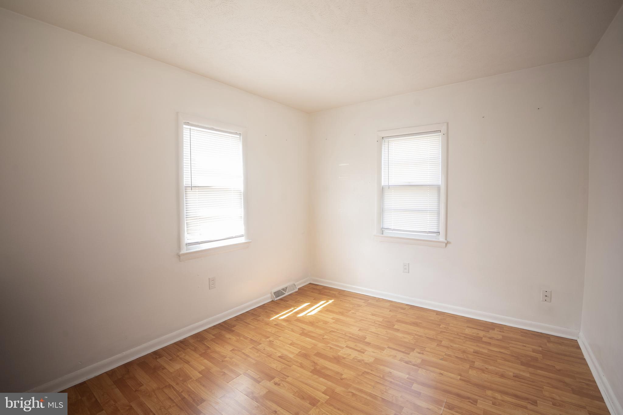 452 Acton Street Front Royal, VA 22630 - Photo 17 of 44 an empty room with wooden floor and windows