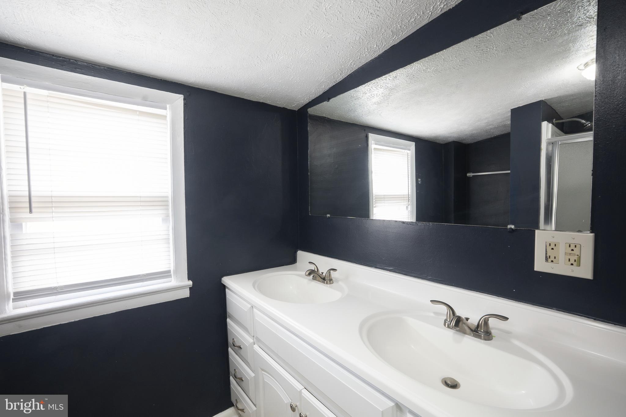 452 Acton Street Front Royal, VA 22630 - Photo 24 of 44 a bathroom with a sink and a mirror