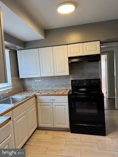 452 Acton Street Front Royal, VA 22630 - Photo 27 of 44 a kitchen with granite countertop white cabinets and stainless steel appliances