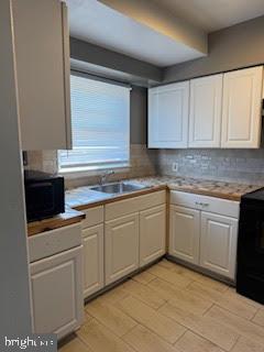 452 Acton Street Front Royal, VA 22630 - Photo 29 of 44 a kitchen with cabinets appliances and a window