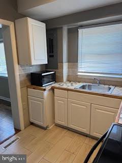 452 Acton Street Front Royal, VA 22630 - Photo 31 of 44 a kitchen with granite countertop white cabinets and white appliances