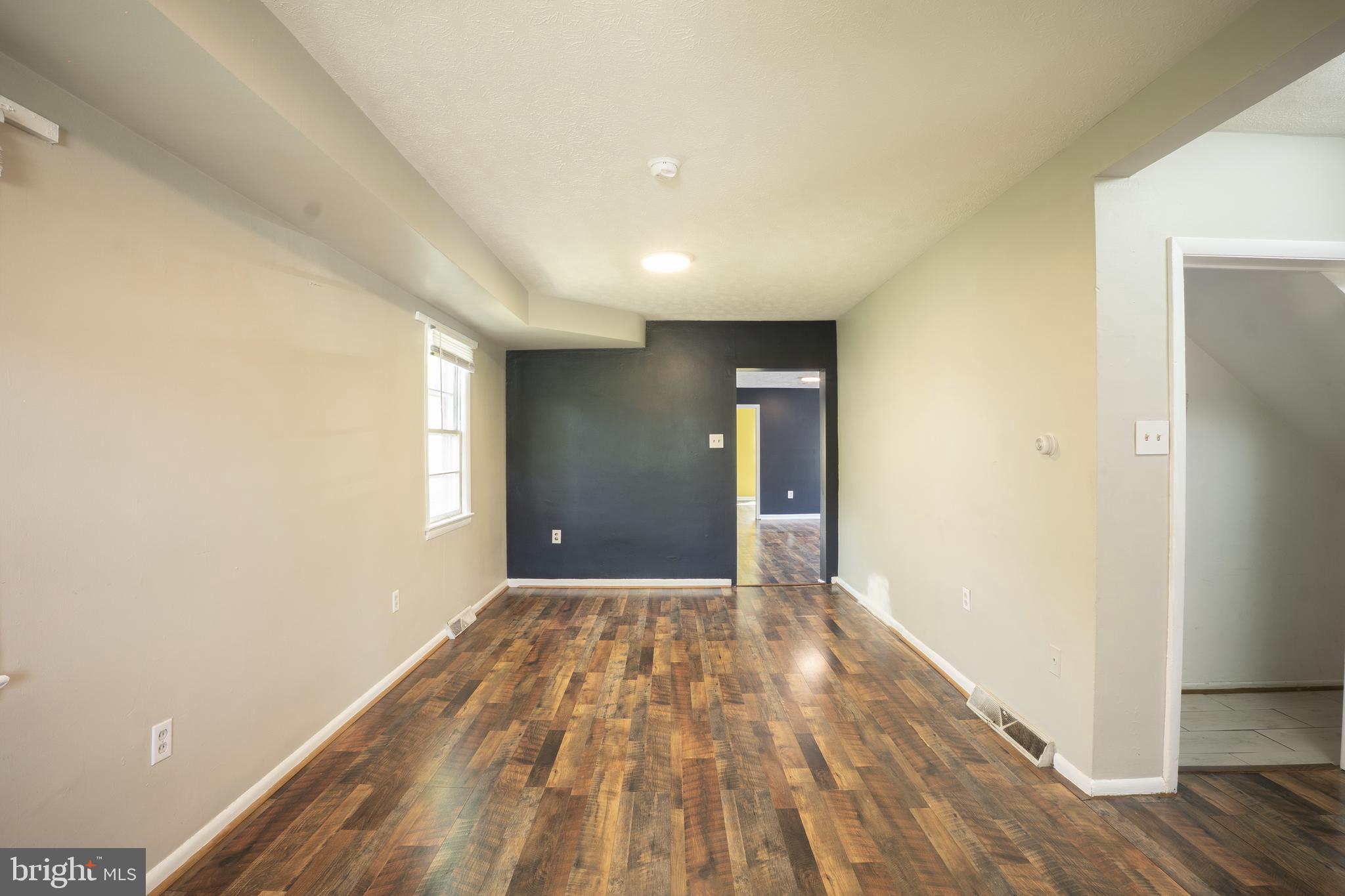 452 Acton Street Front Royal, VA 22630 - Photo 4 of 44 a view of wooden floor in an empty room