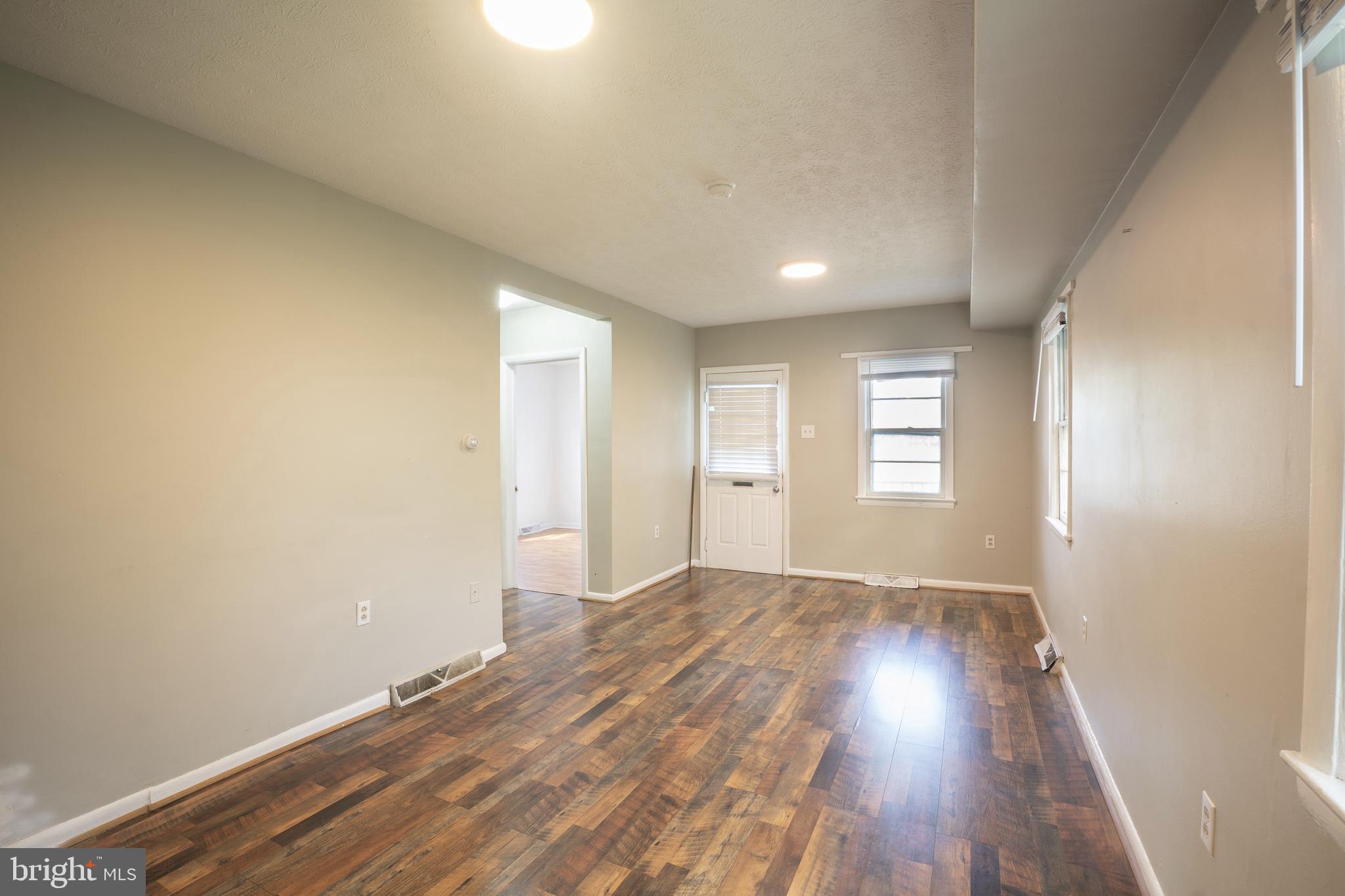 452 Acton Street Front Royal, VA 22630 - Photo 6 of 44 wooden floor in an empty room with a window