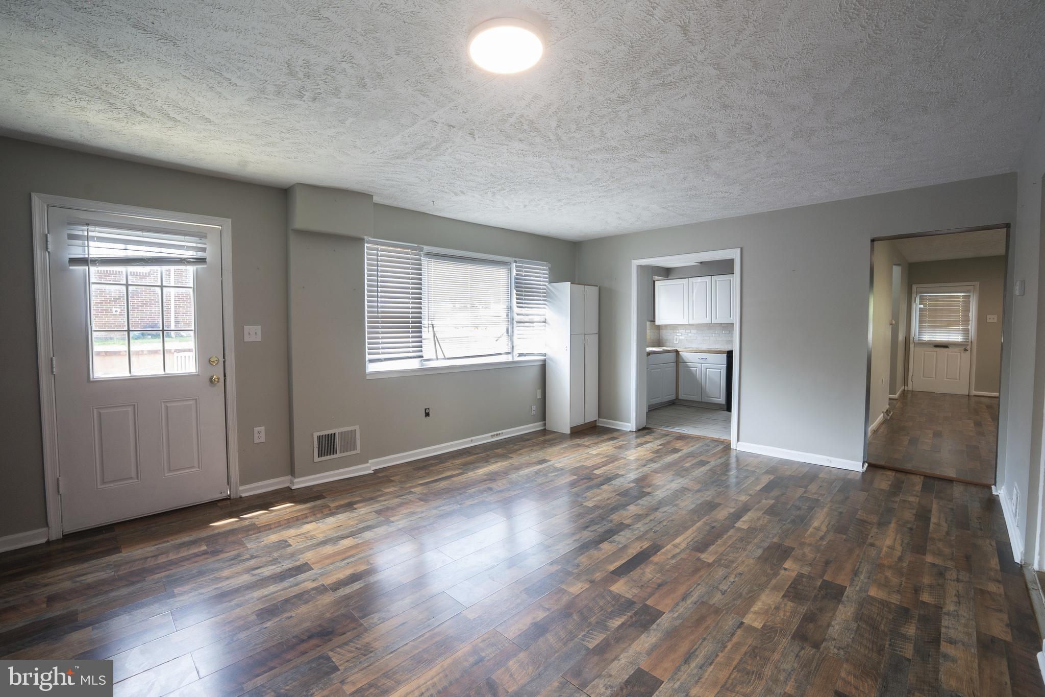 452 Acton Street Front Royal, VA 22630 - Photo 8 of 44 an empty room with wooden floor and windows