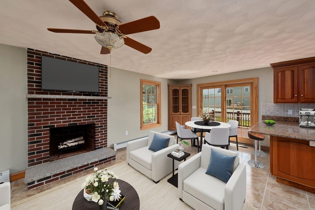 26 Gilman Road Billerica, MA 01862 - Photo 5 of 32 a living room with furniture a fireplace and a window