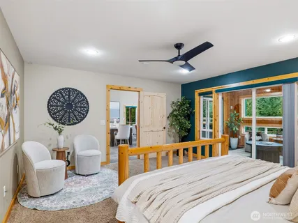 a bedroom with a large bed and a large window