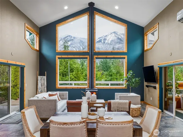 a kitchen with cabinets and chairs