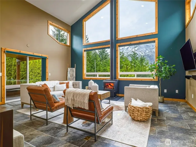 a kitchen with kitchen island granite countertop wooden cabinets stainless steel appliances a sink and a center island