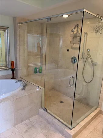 a bathroom with a shower and a sink