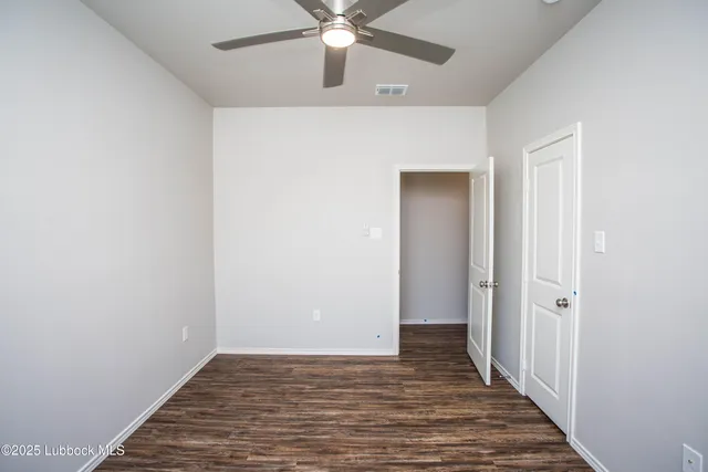 a bathroom with a granite countertop sink a mirror and bathtub