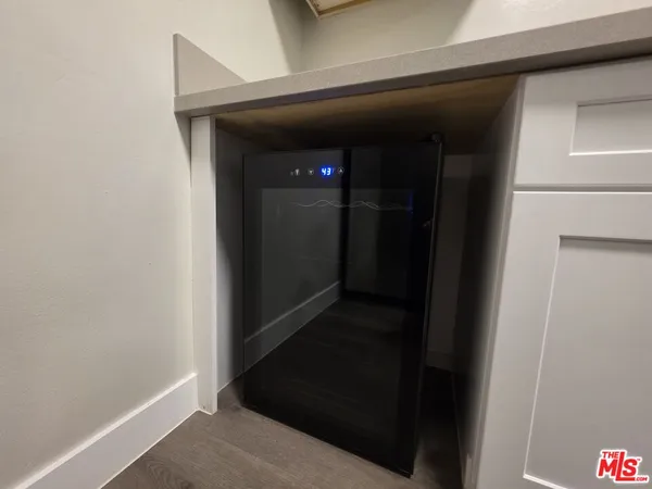 a view of hallway with wooden floor