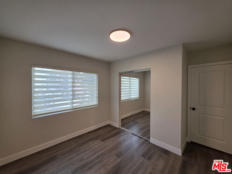 1411 Innes Place, Unit 1 Venice, CA 90291 - Photo 28 of 53 an empty room with wooden floor and windows