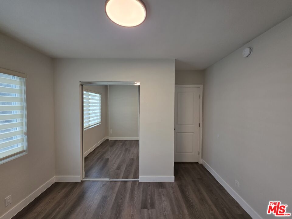 1411 Innes Place, Unit 1 Venice, CA 90291 - Photo 29 of 53 an empty room with wooden floor and windows