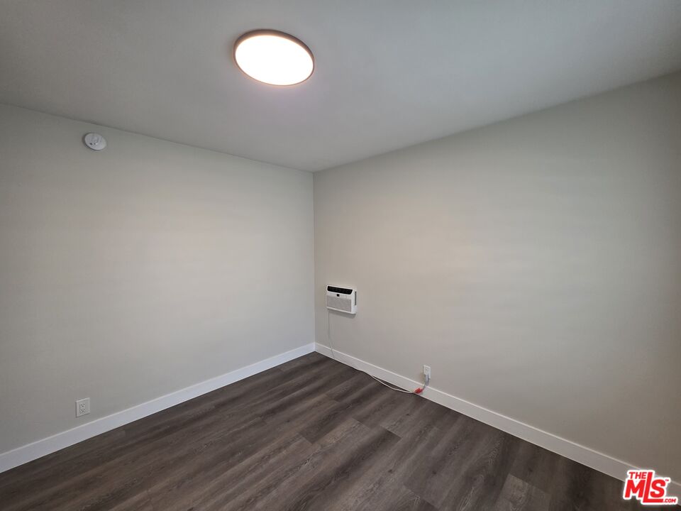 1411 Innes Place, Unit 1 Venice, CA 90291 - Photo 32 of 53 a view of an empty room with wooden floor and a window