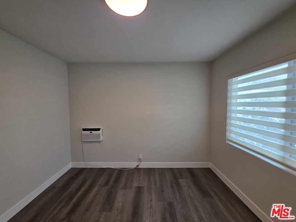 1411 Innes Place, Unit 1 Venice, CA 90291 - Photo 33 of 53 a view of an empty room with wooden floor and a window