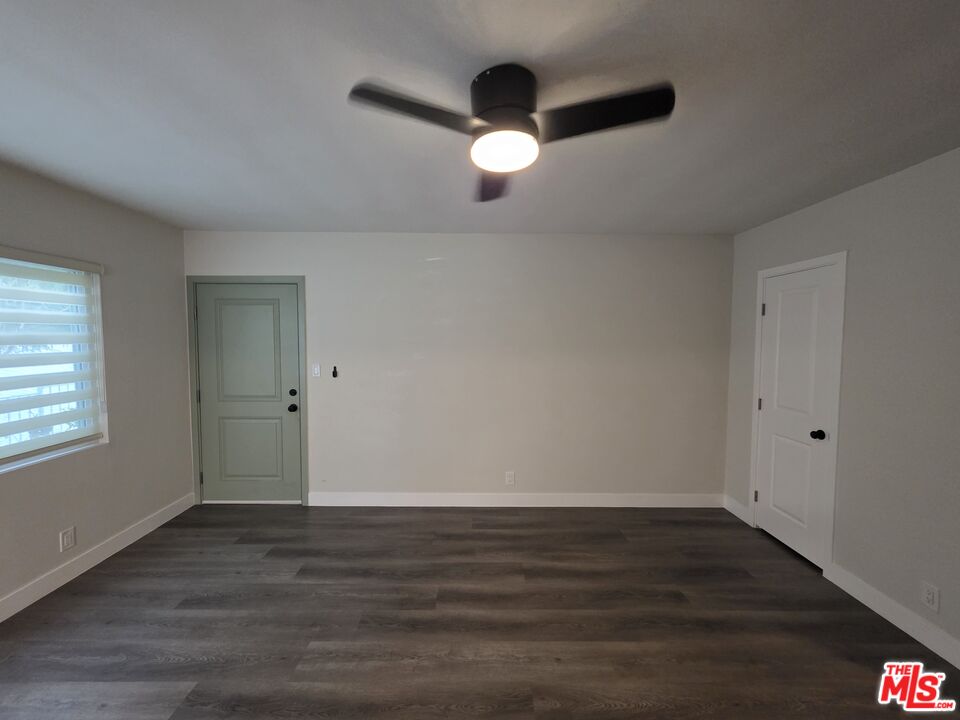 1411 Innes Place, Unit 1 Venice, CA 90291 - Photo 42 of 53 an empty room with wooden floor and windows