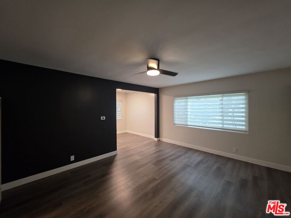 1411 Innes Place, Unit 1 Venice, CA 90291 - Photo 43 of 53 a view of an empty room with wooden floor and a window