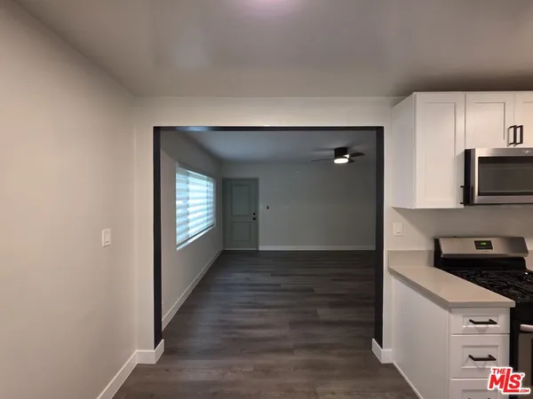 a kitchen with a stove and a microwave