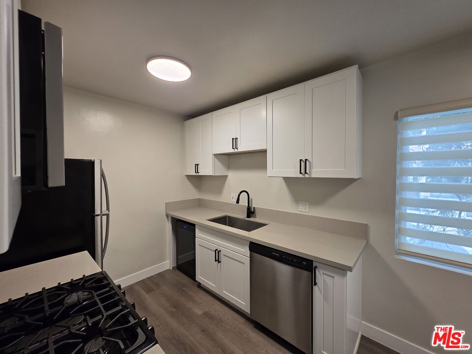 1411 Innes Place, Unit 1 Venice, CA 90291 - Photo 49 of 53 a kitchen with a sink stove and refrigerator
