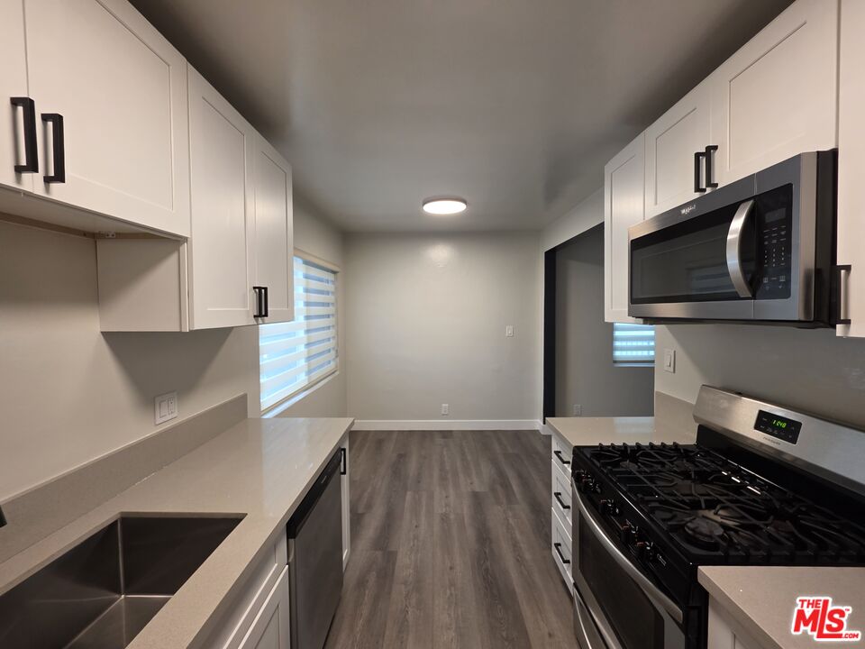 1411 Innes Place, Unit 1 Venice, CA 90291 - Photo 50 of 53 a kitchen with a stove and a microwave