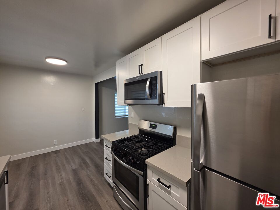 1411 Innes Place, Unit 1 Venice, CA 90291 - Photo 51 of 53 a kitchen with stainless steel appliances a refrigerator stove and microwave