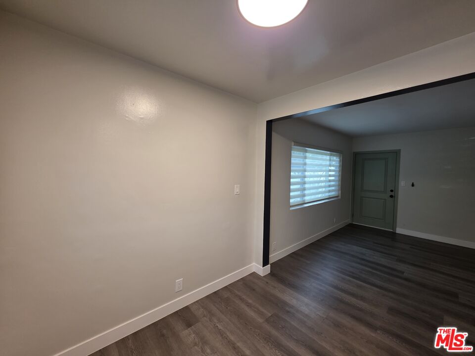 1411 Innes Place, Unit 1 Venice, CA 90291 - Photo 8 of 53 a view of an empty room with wooden floor and a window