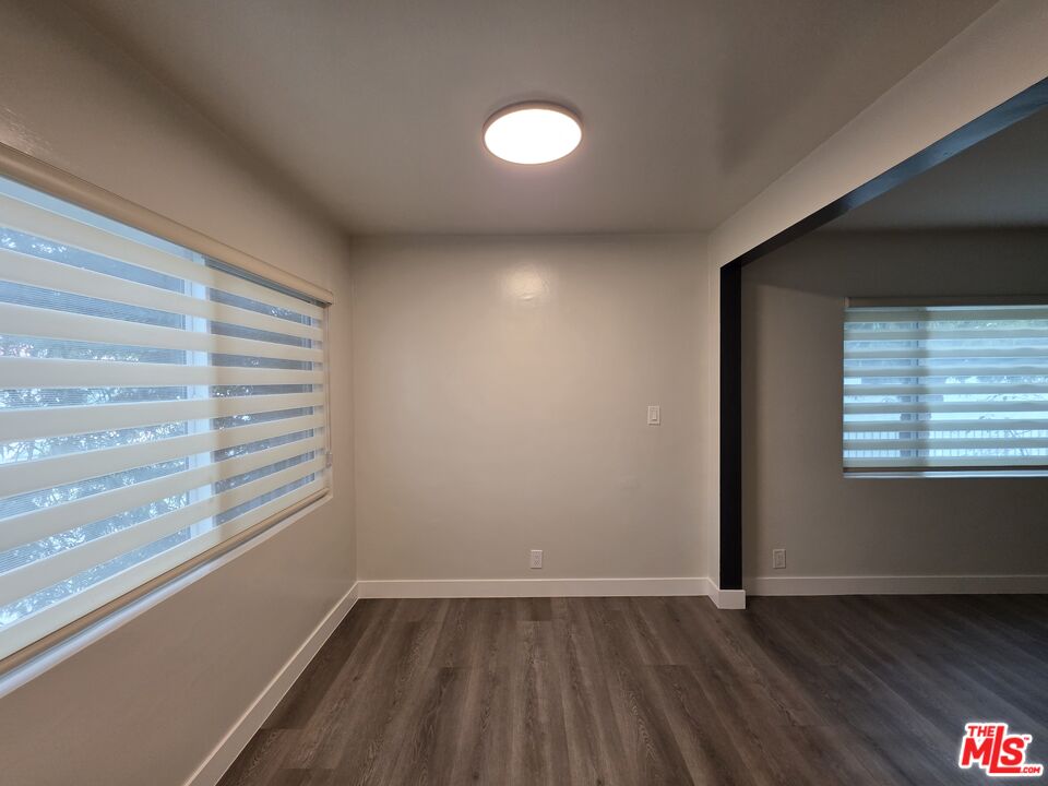 1411 Innes Place, Unit 1 Venice, CA 90291 - Photo 9 of 53 a view of an empty room with wooden floor and a window