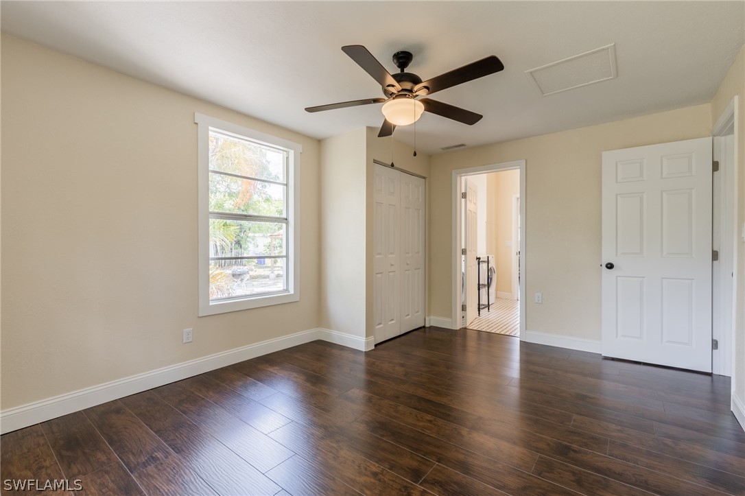 1806 Coronado Road Fort Myers, FL 33901 - Photo 12 of 23 a view of an empty room with wooden floor and a window