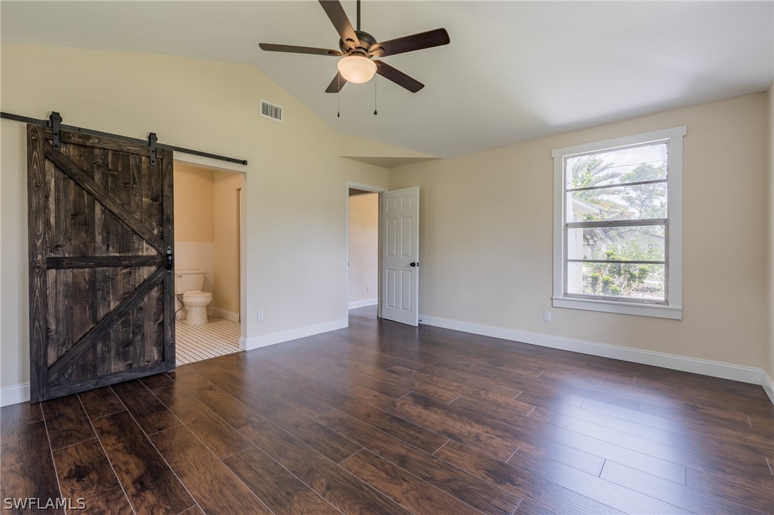 1806 Coronado Road Fort Myers, FL 33901 - Photo 16 of 23 an empty room with wooden floor closet and windows
