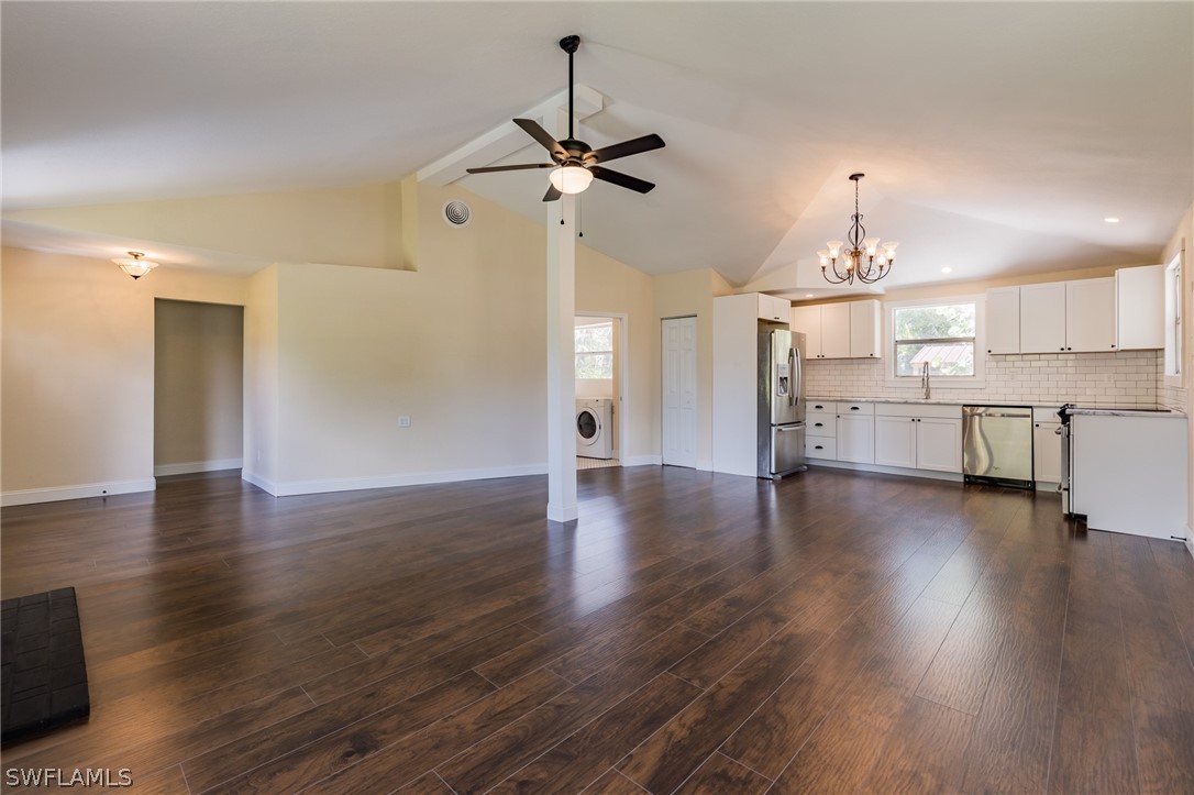 1806 Coronado Road Fort Myers, FL 33901 - Photo 6 of 23 a view of a kitchen with a dishwasher a stove and a wooden floor