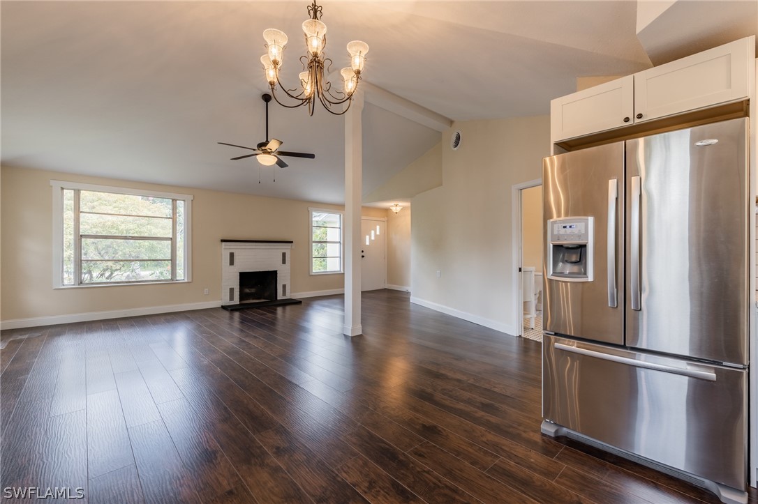1806 Coronado Road Fort Myers, FL 33901 - Photo 10 of 23 a view of a kitchen with a refrigerator and wooden floor