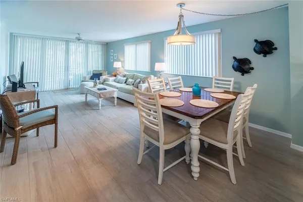 a view of a dining room with furniture and wooden floor
