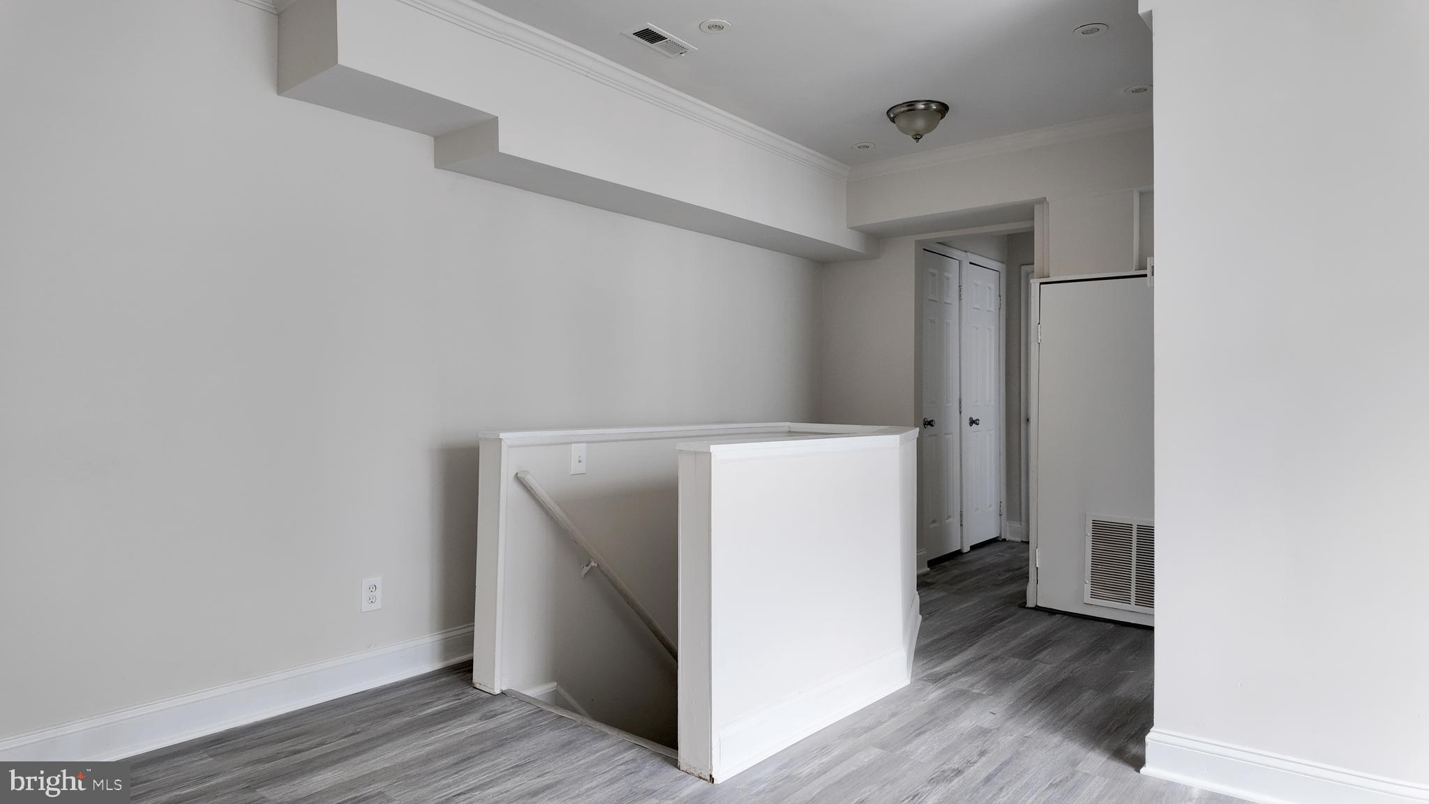 4306 Halley Terrace Southeast, Unit 1 Washington, DC 20032 - Photo 3 of 9 a utility room with wooden floor washer and dryer