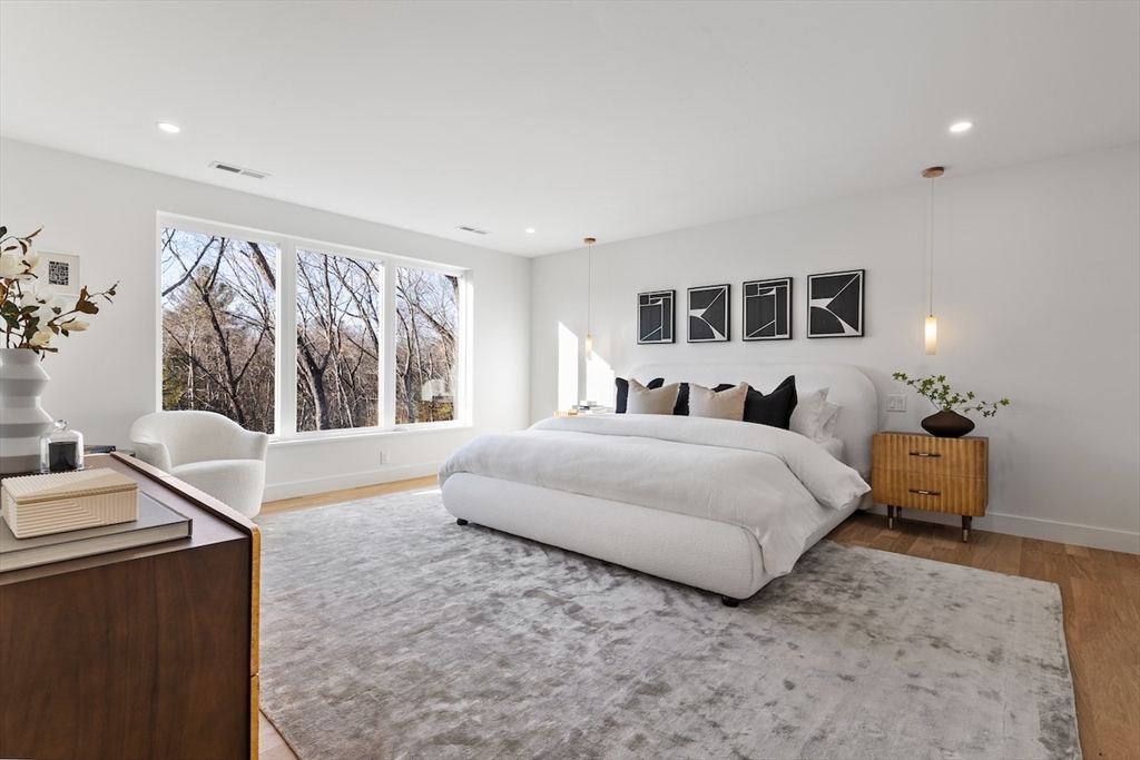 531 Annursnac Hill Road Concord, MA 01742 - Photo 11 of 27 a spacious bedroom with a bed and a window
