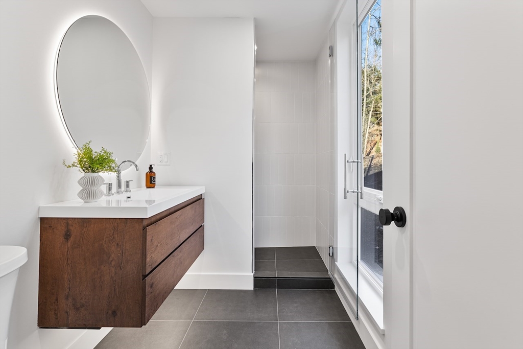 531 Annursnac Hill Road Concord, MA 01742 - Photo 14 of 27 a bathroom with a sink vanity and a mirror