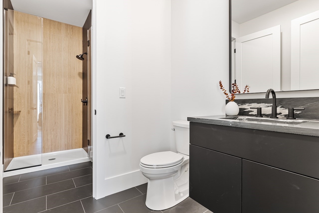 531 Annursnac Hill Road Concord, MA 01742 - Photo 19 of 27 a bathroom with a sink a toilet and a mirror