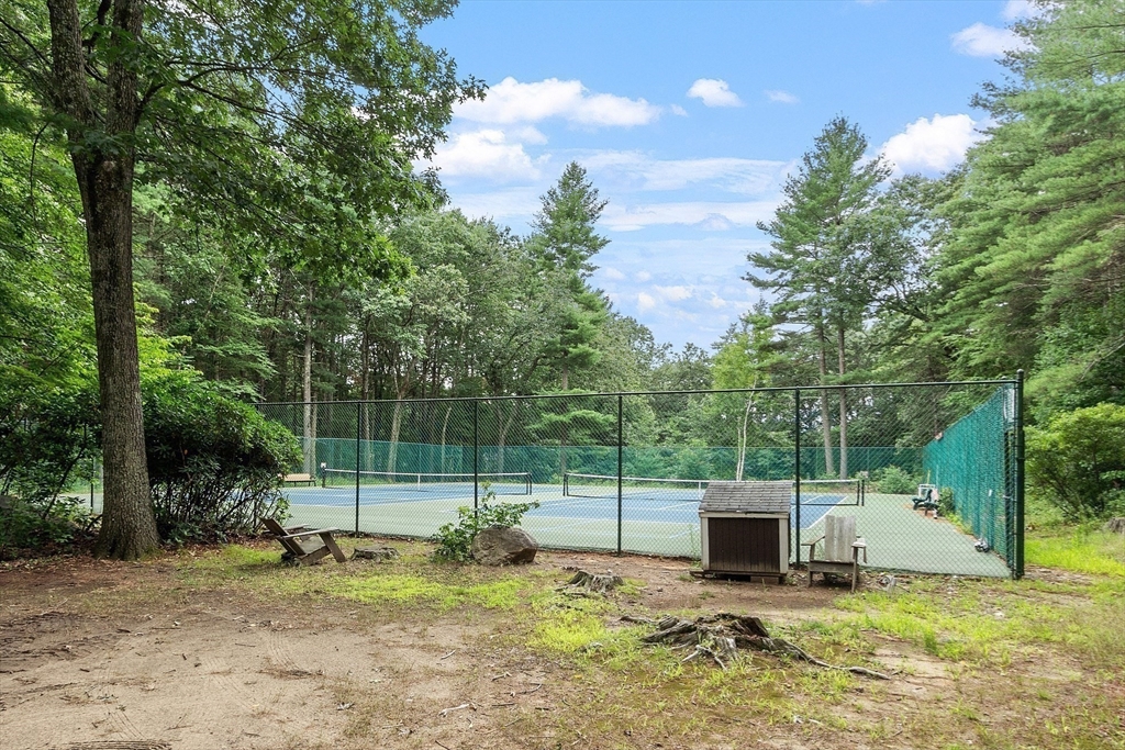 531 Annursnac Hill Road Concord, MA 01742 - Photo 25 of 27 a view of a backyard with a trampoline