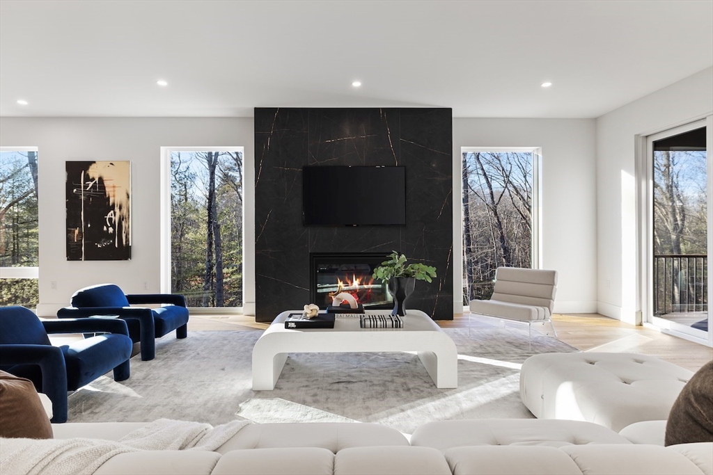 531 Annursnac Hill Road Concord, MA 01742 - Photo 6 of 27 a living room with furniture window and a fireplace