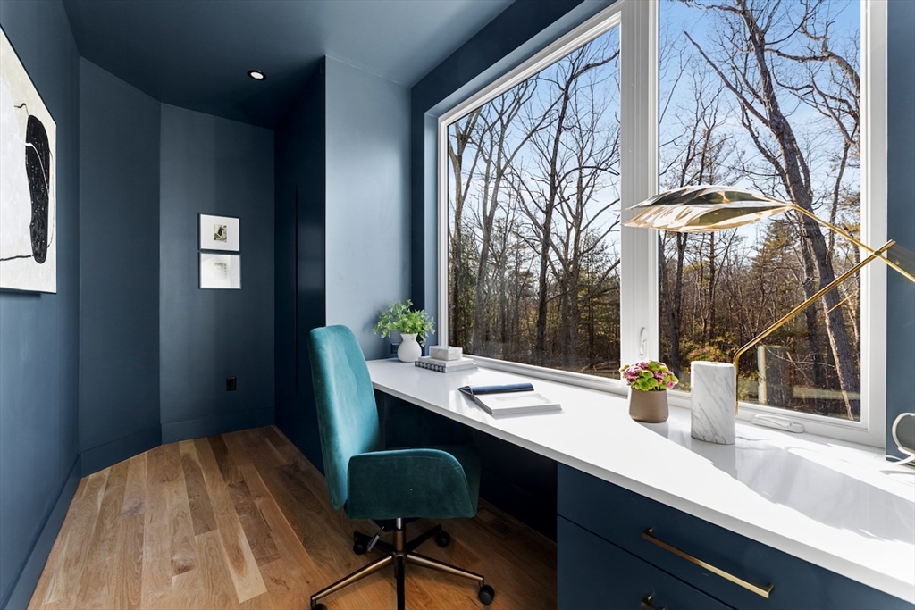 531 Annursnac Hill Road Concord, MA 01742 - Photo 9 of 27 a view of a dining room with a table and chairs
