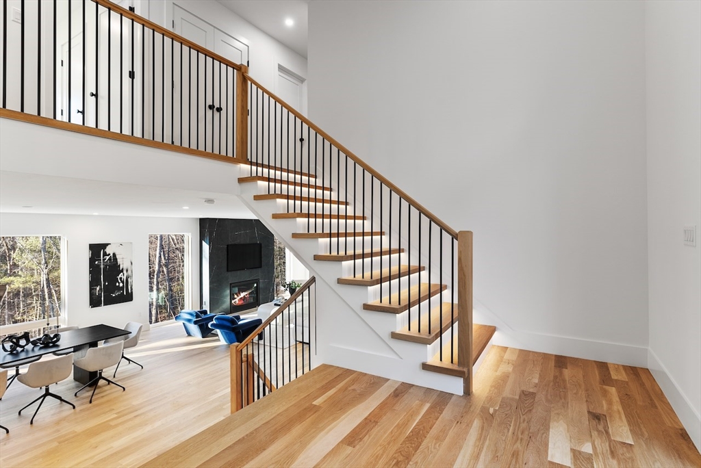 531 Annursnac Hill Road Concord, MA 01742 - Photo 10 of 27 a view of entryway with wooden floor and livingroom view
