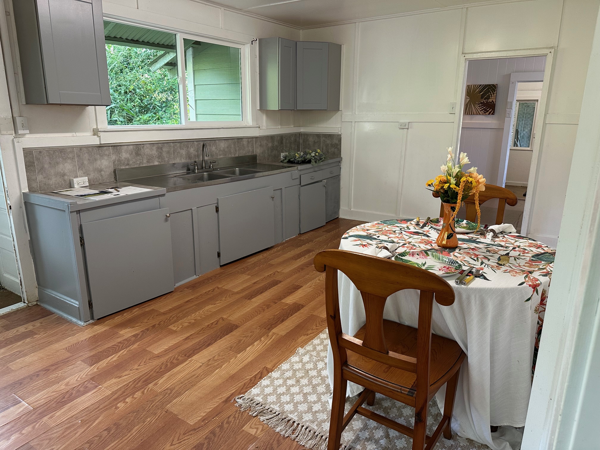 55-680 Hawi Road Hawi, HI 96719 - Photo 20 of 30 a kitchen with stainless steel appliances granite countertop a sink and a stove