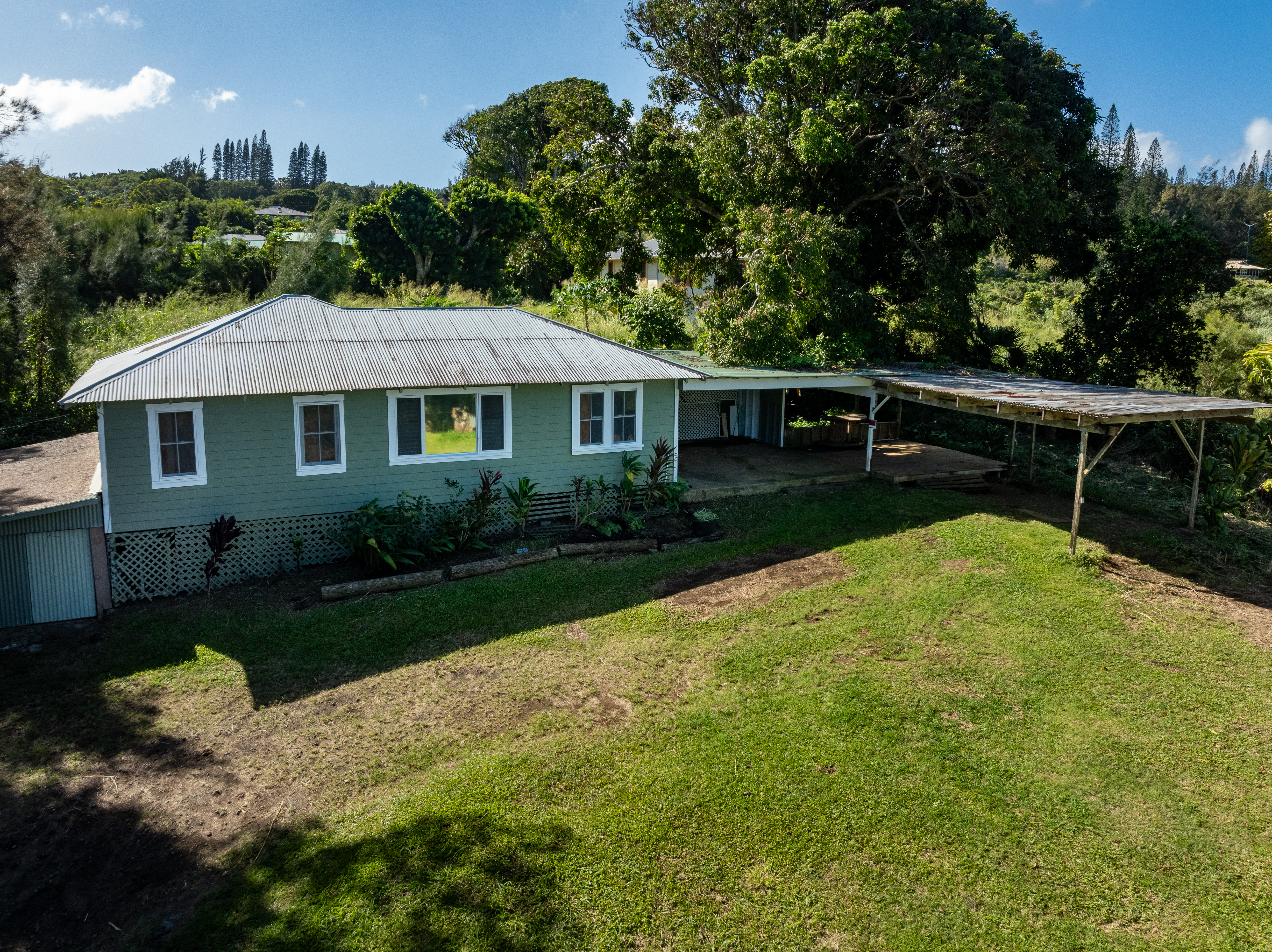 55-680 Hawi Road Hawi, HI 96719 - Photo 2 of 30 a view of a house with backyard and garden