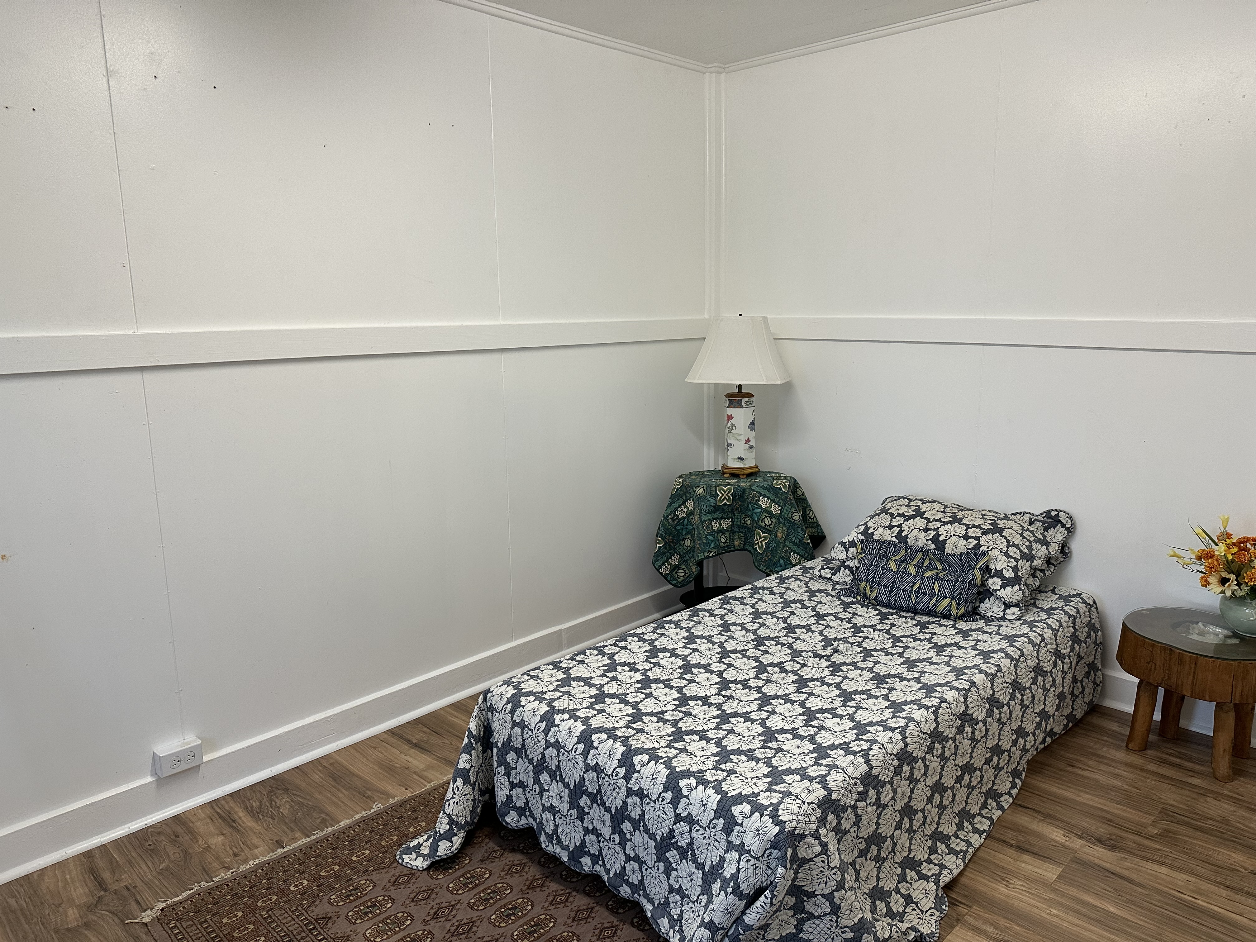 55-680 Hawi Road Hawi, HI 96719 - Photo 25 of 30 a bedroom with a bed and a table